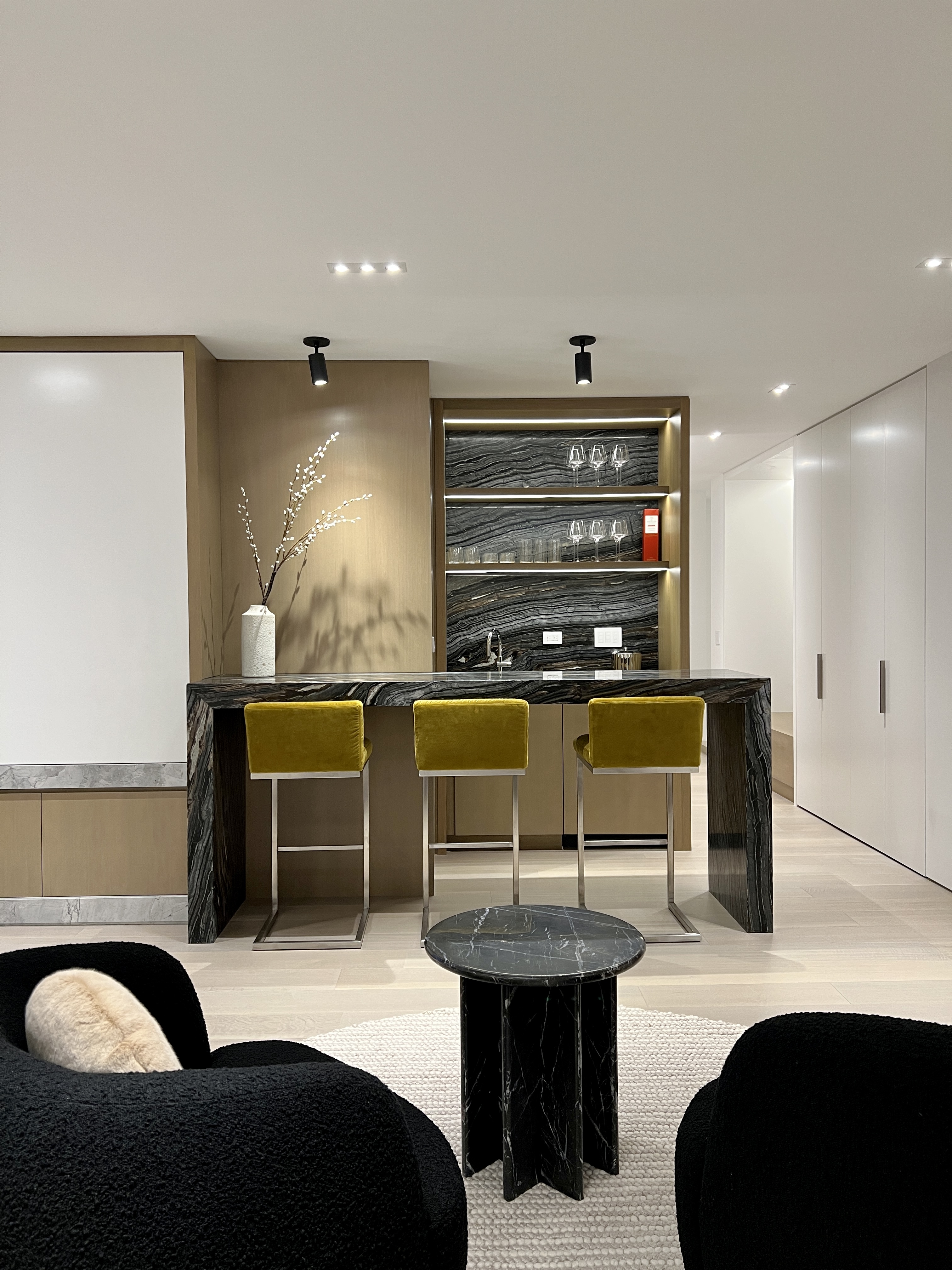 303 East 57th Street, Unit 44G Manhattan, NY 10022 - Photo 3 of 19 a living room with furniture a flat screen tv and kitchen view