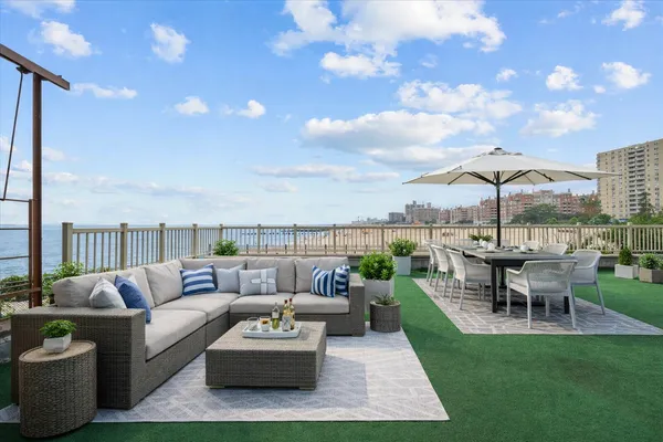a view of a patio with couches and chairs