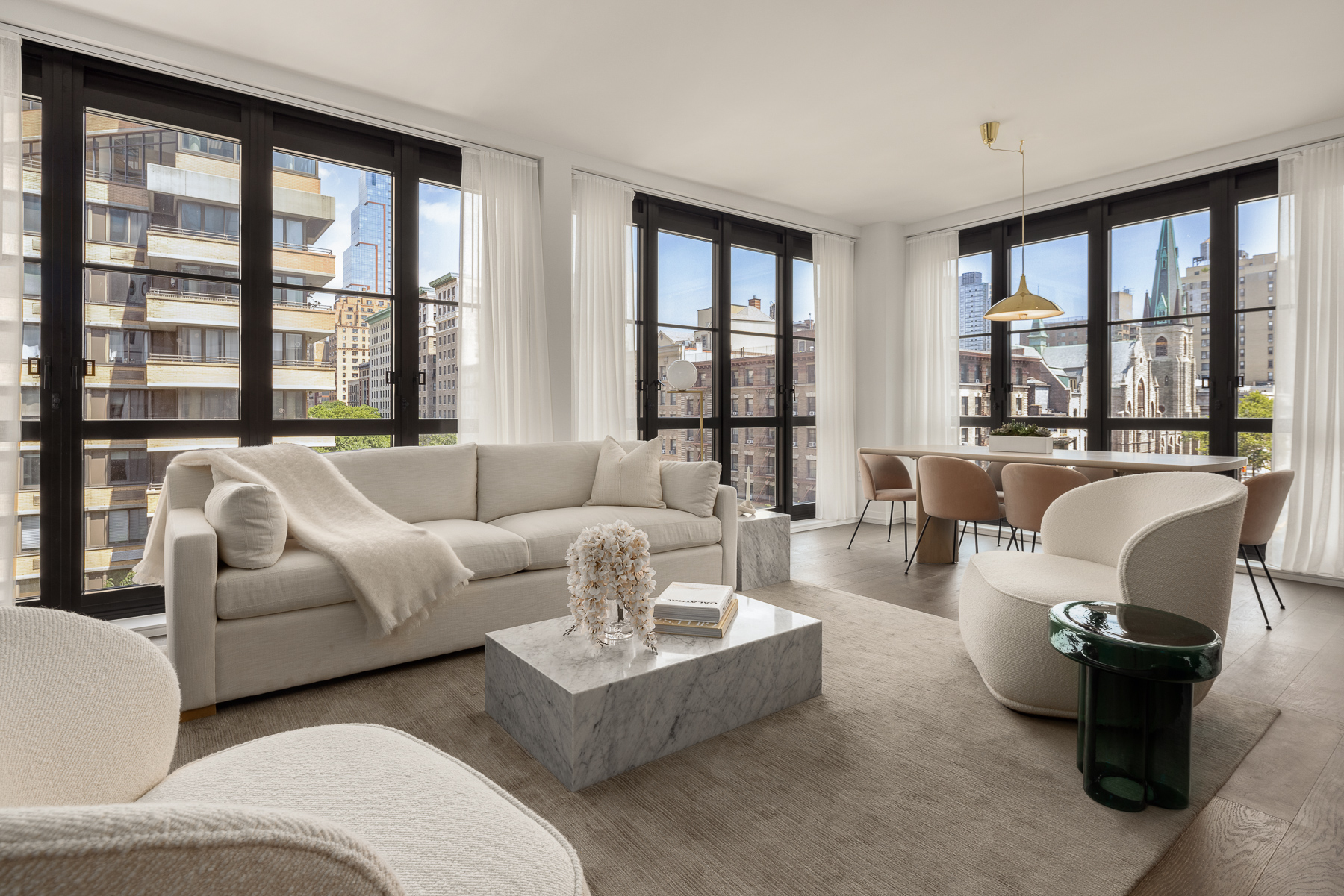 250 West 96th Street, Unit 5D Manhattan, NY 10025 - Photo 1 of 28 a living room with furniture and large windows
