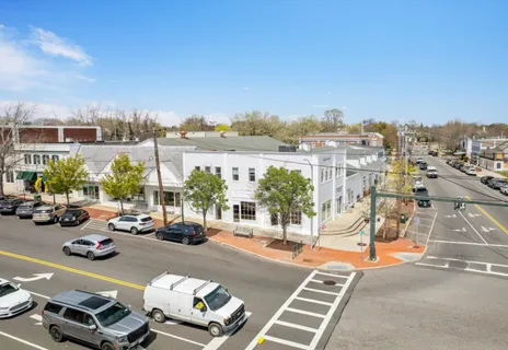 a view of a city street with cars