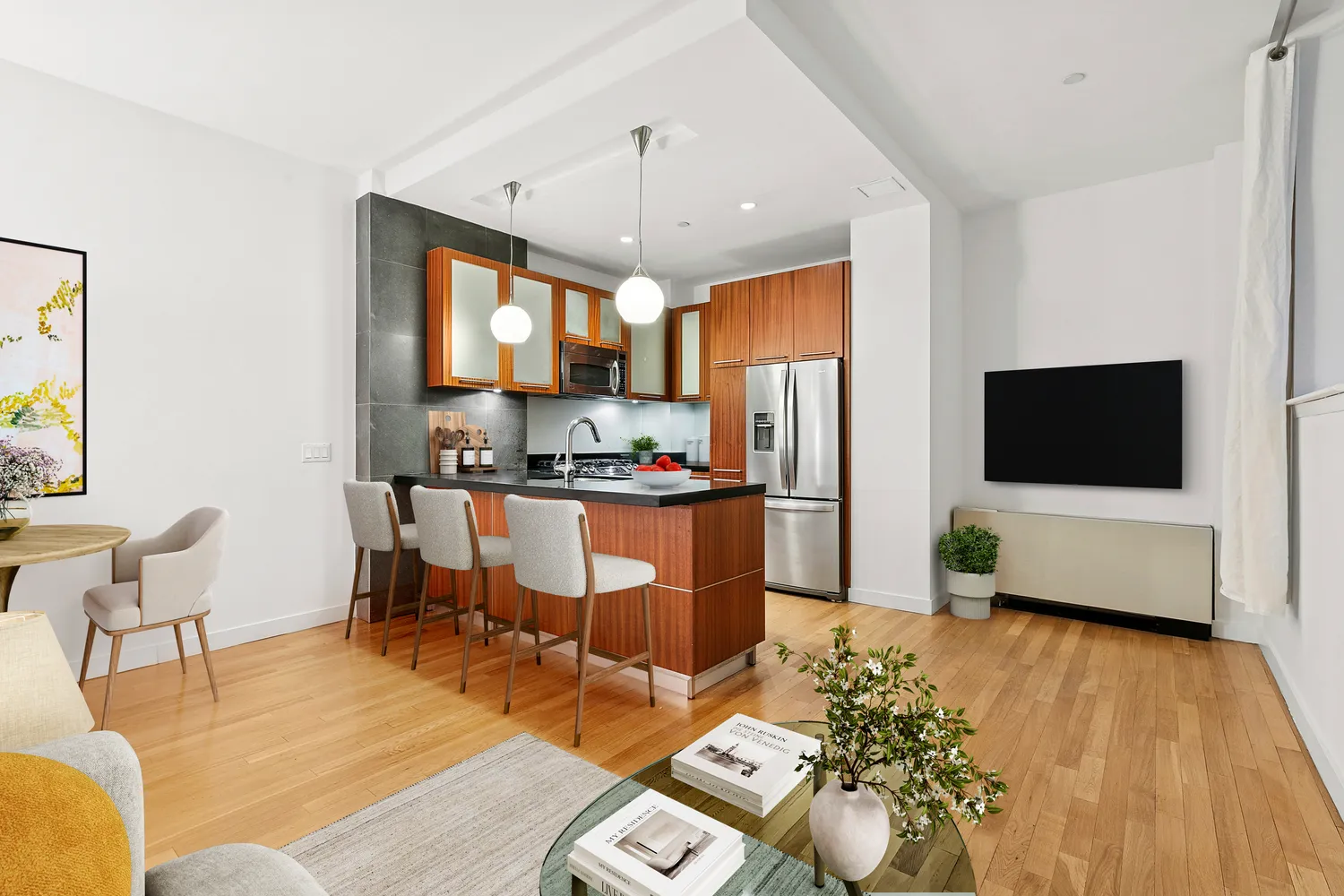 a living room with furniture and a flat screen tv