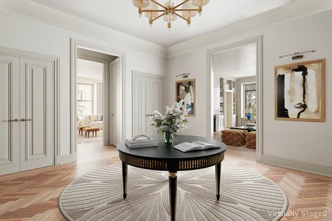 a view of a livingroom with furniture and wooden floor