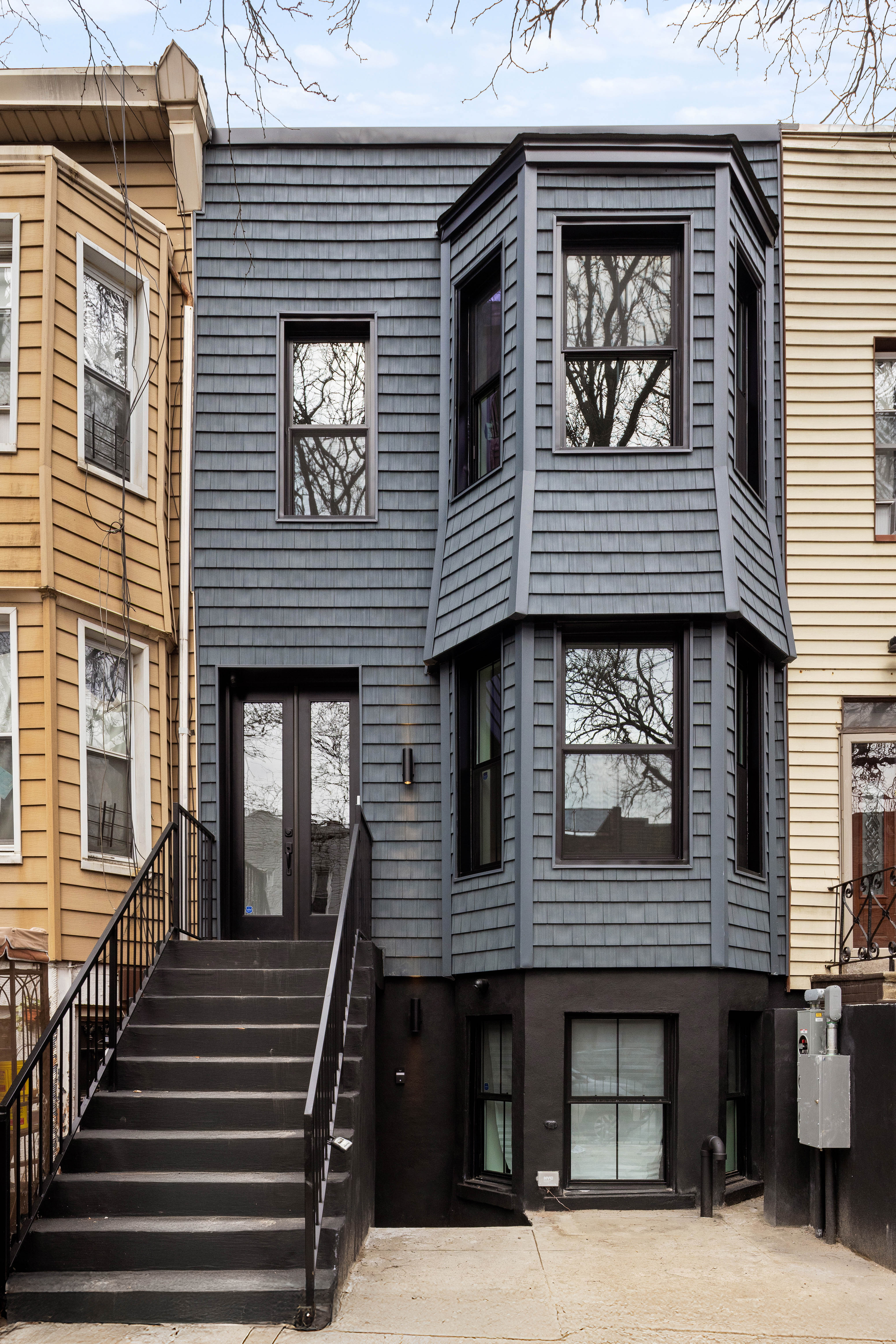 131 Weirfield Street Brooklyn, NY 11221 - Photo 12 of 14 a front view of a house with stairs