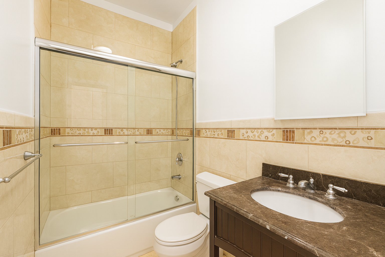 37-15 Broadway, Unit 3 Queens, NY 11103 - Photo 9 of 9 a bathroom with a granite countertop sink mirror vanity and toilet