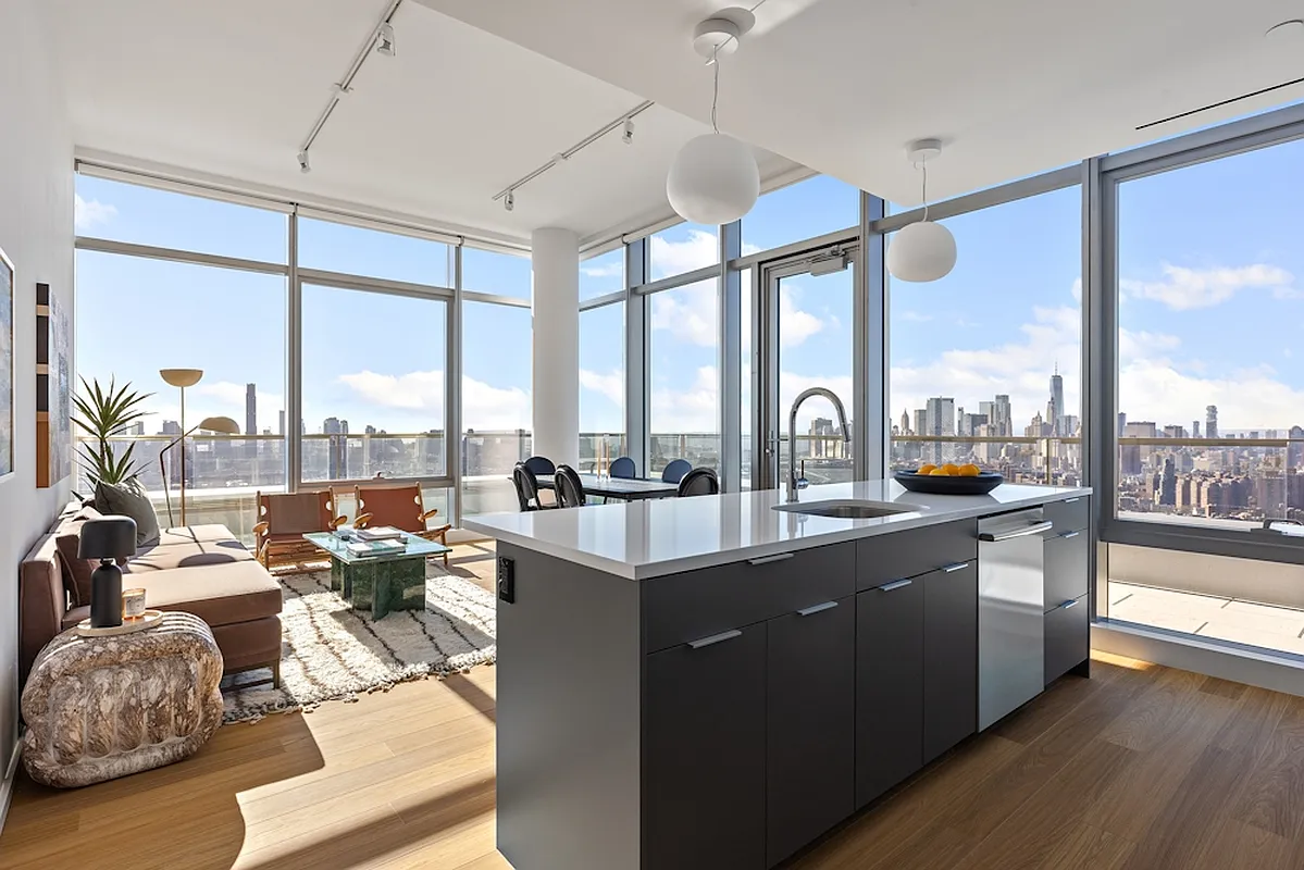 5 South 5th Street, Unit PH2B Brooklyn, NY 11249 - Photo 2 of 27 a very nice looking living room with a large window and a wooden floor
