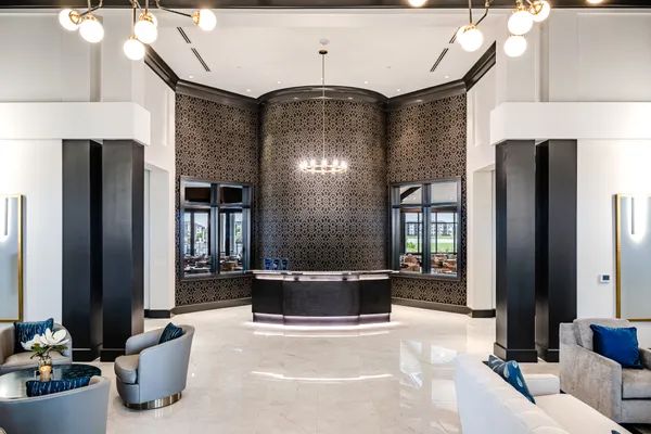 a living room with furniture and a large window