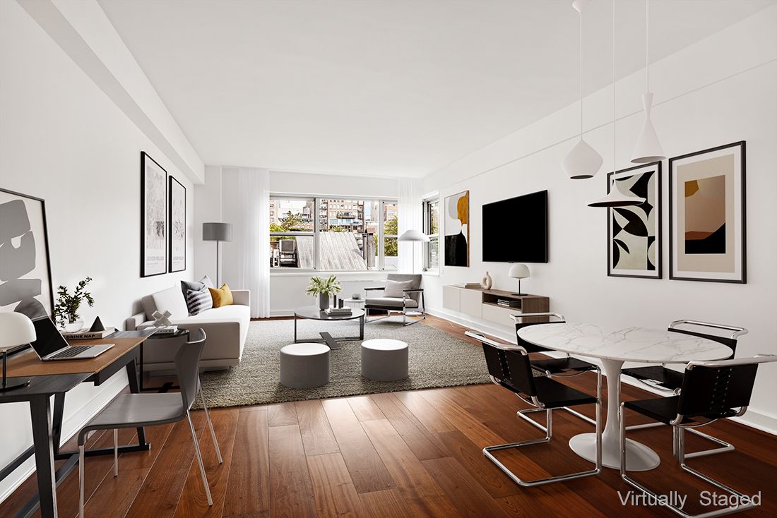a living room with fireplace furniture and a flat screen tv