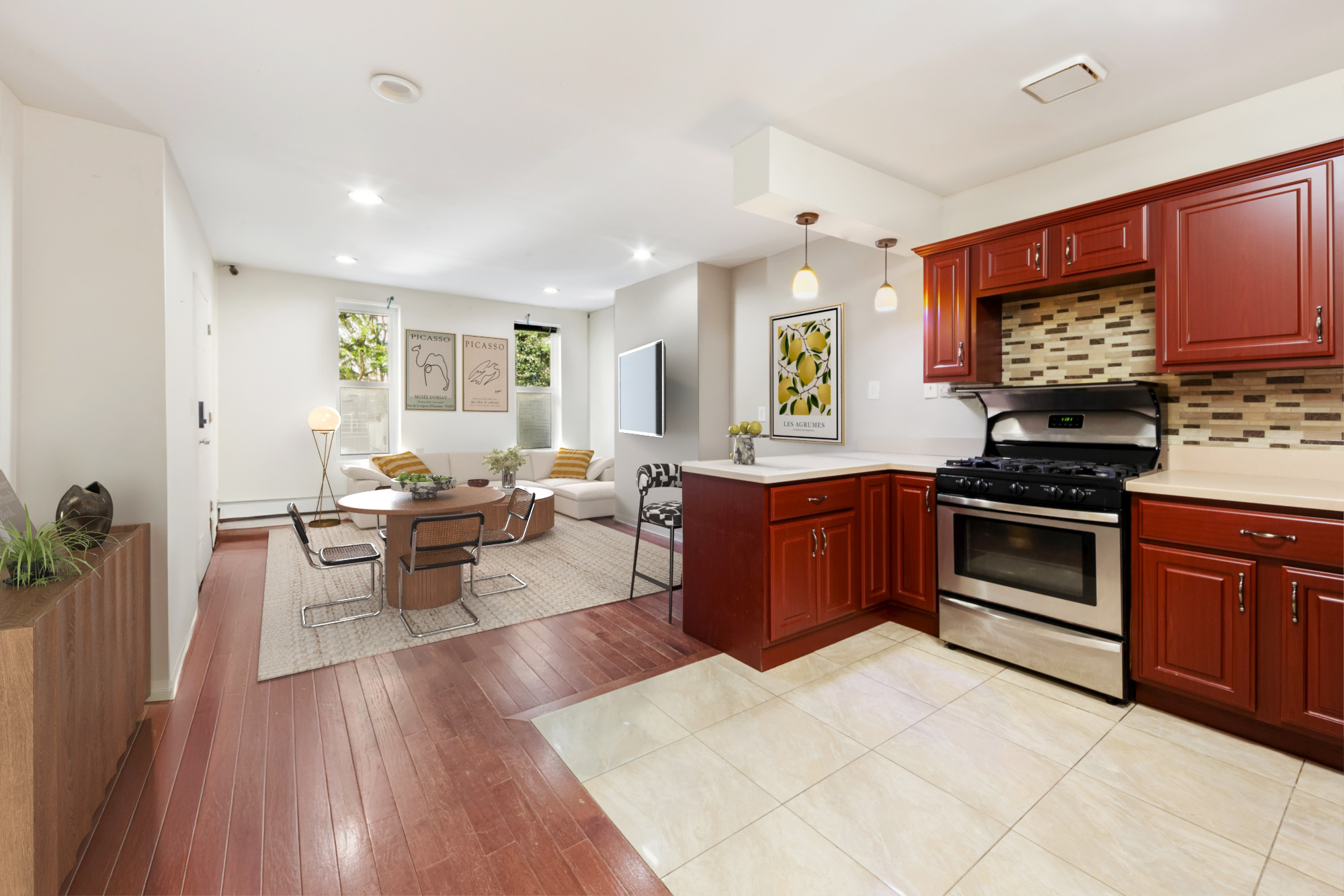 a kitchen with stainless steel appliances granite countertop a stove top oven a sink dishwasher a dining table and chairs with wooden floor