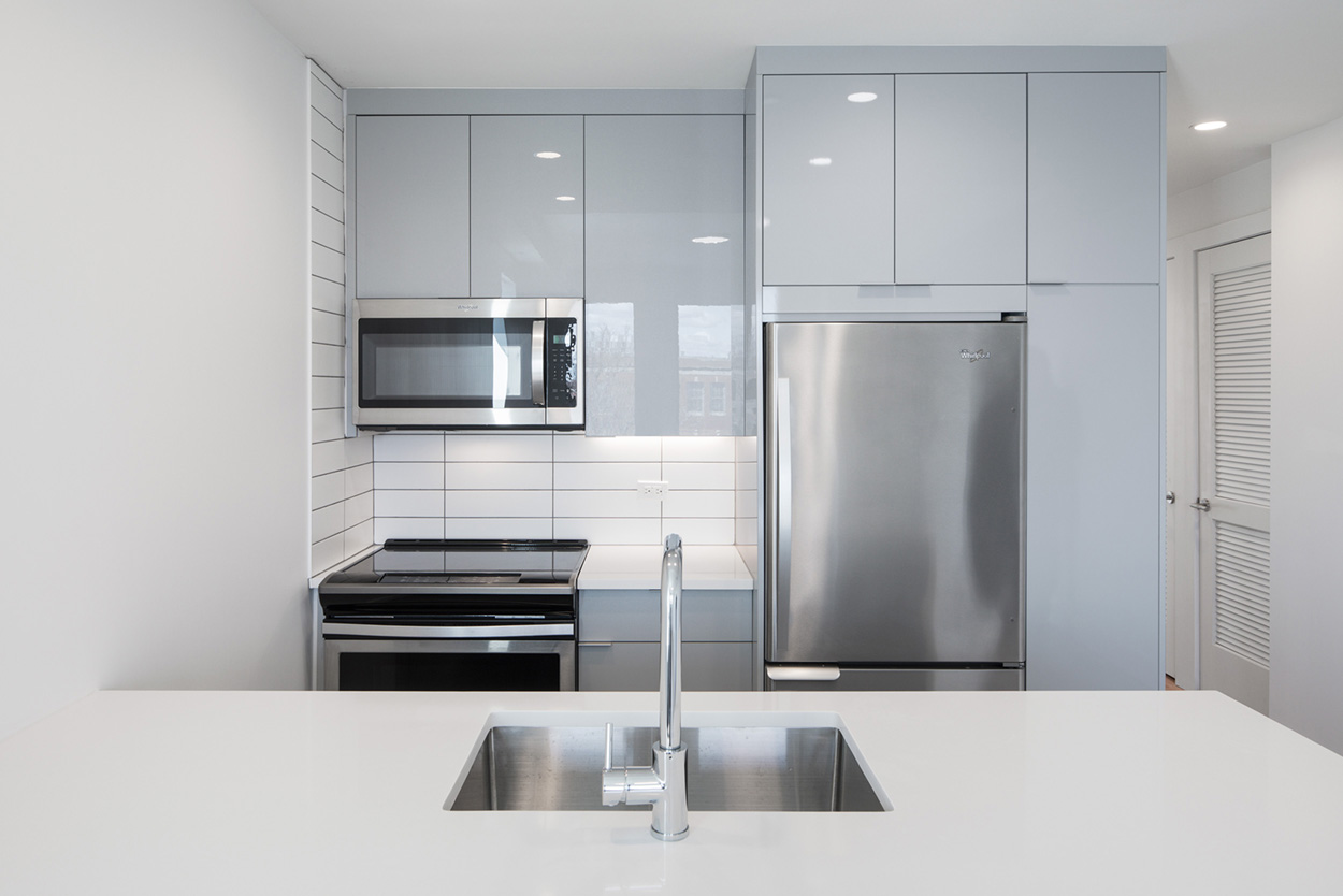 195 Clarkson Avenue, Unit 6E Brooklyn, NY 11226 - Photo 2 of 13 a kitchen with stainless steel appliances a refrigerator and a microwave