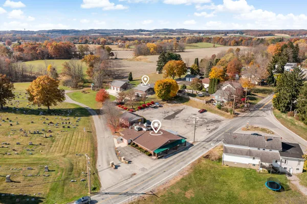 an aerial view of residential houses with outdoor space