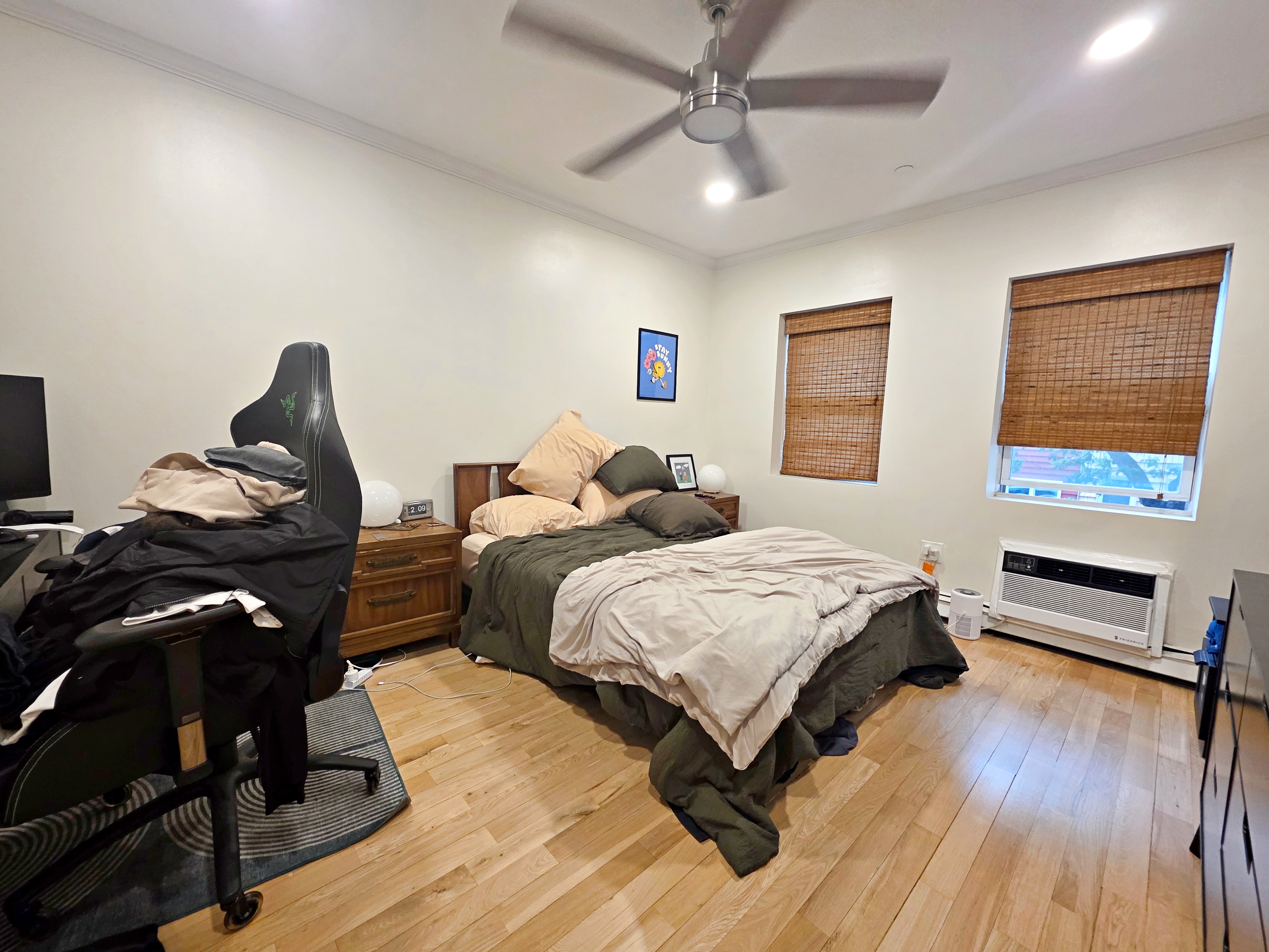 190 Meserole Avenue, Unit 2N Brooklyn, NY 11222 - Photo 7 of 10 a bedroom with a bed and wooden floor