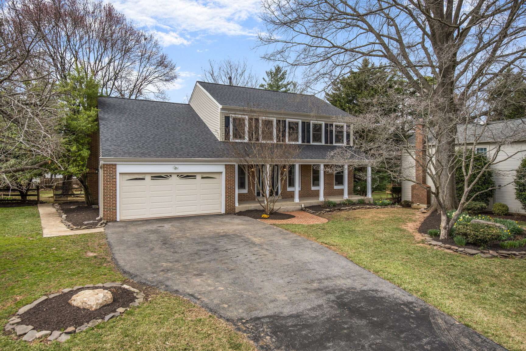 4008 Evangeline Terrace Olney, MD 20832 - Photo 2 of 54 a front view of a house with a yard and garage