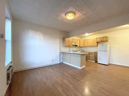 a view of kitchen with wooden floor