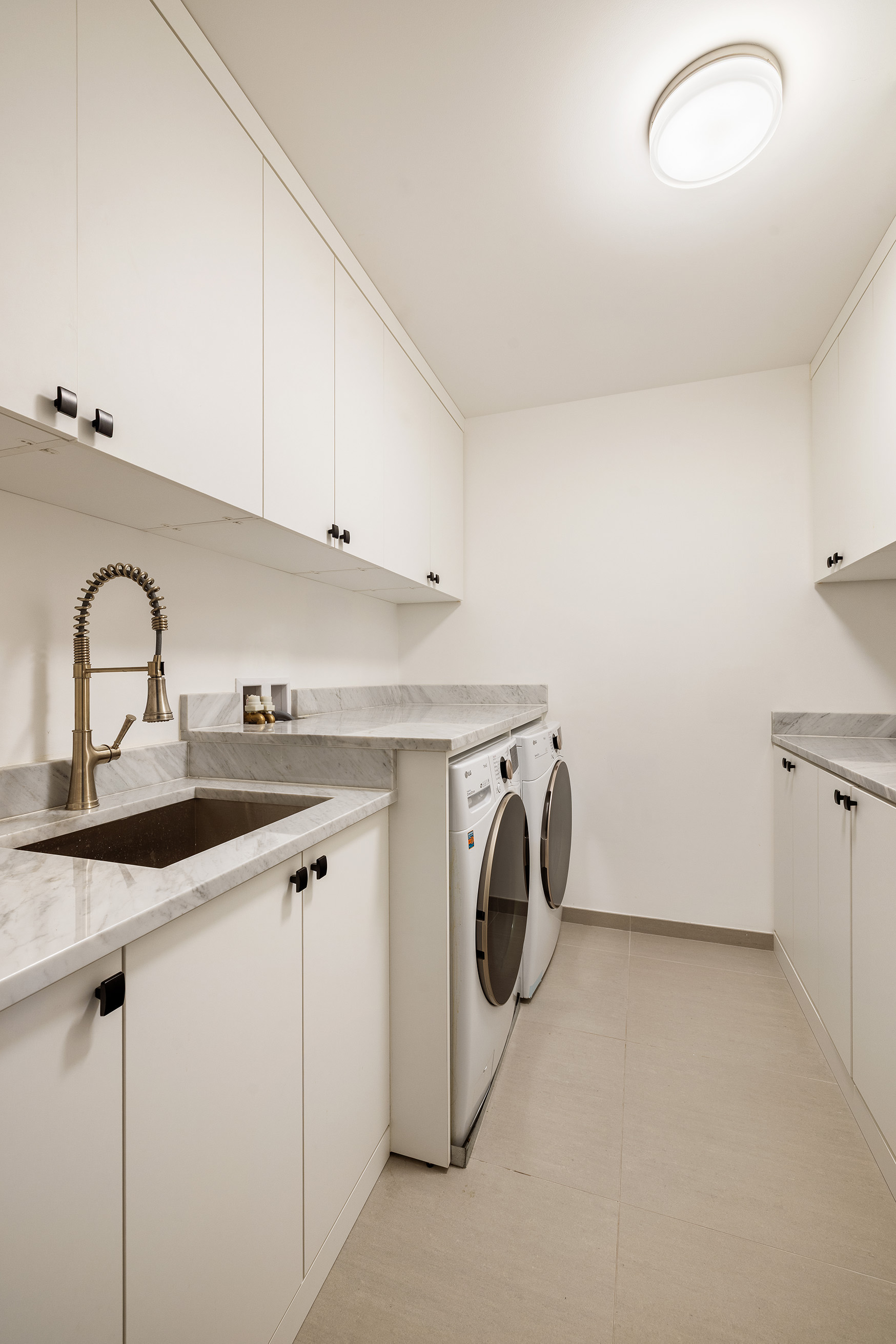 1 West End Avenue, Unit 25F Manhattan, NY 10023 - Photo 14 of 15 a utility room with dryer and washer