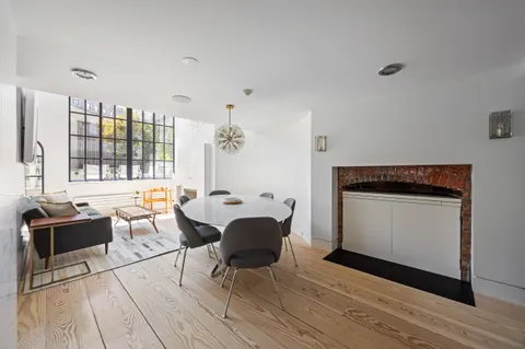 a view of a kitchen with a sink and furniture