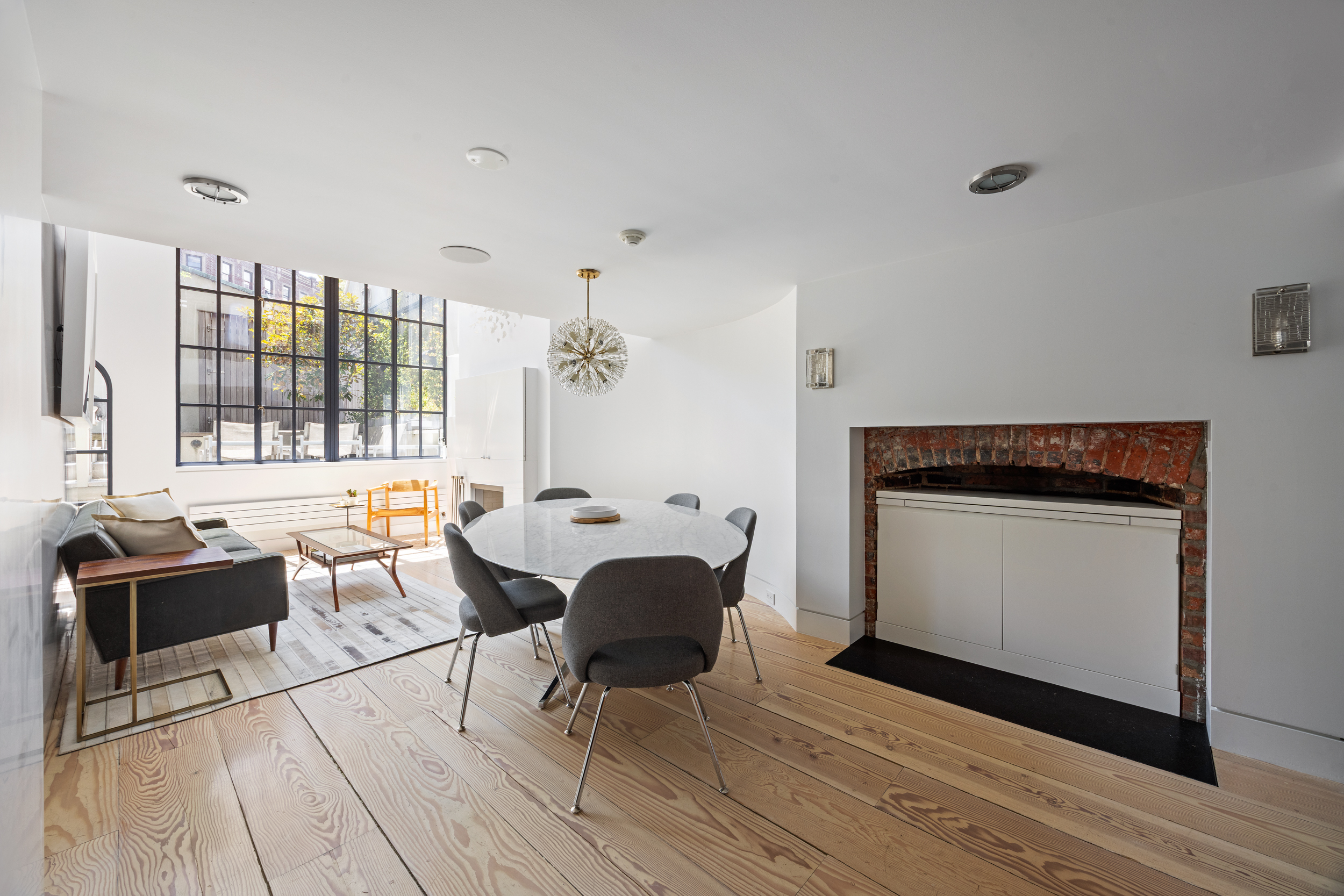 39 Barrow Street Manhattan, NY 10014 - Photo 6 of 39 a view of a kitchen with a sink and furniture