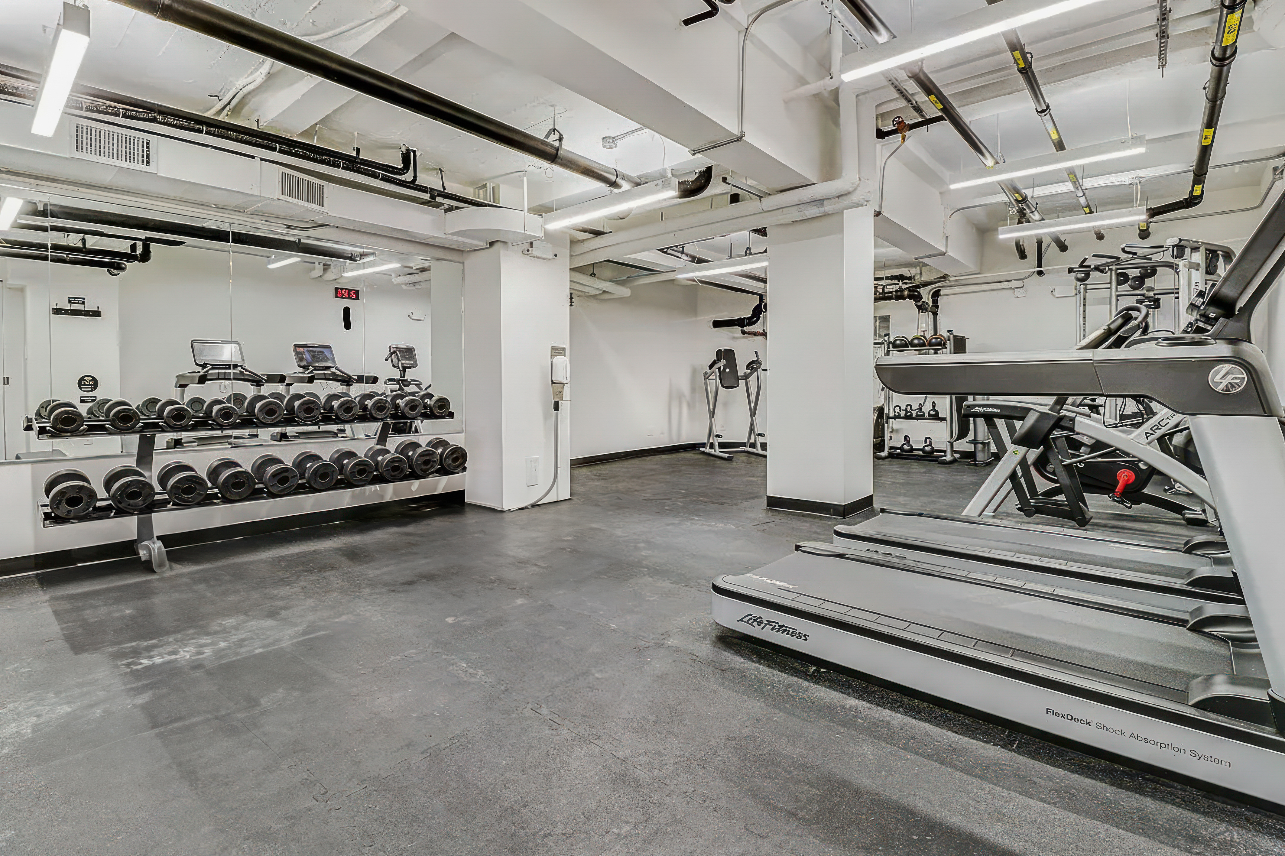 176 West 87th Street, Unit 1H Manhattan, NY 10024 - Photo 14 of 19 a view of a room with gym equipment