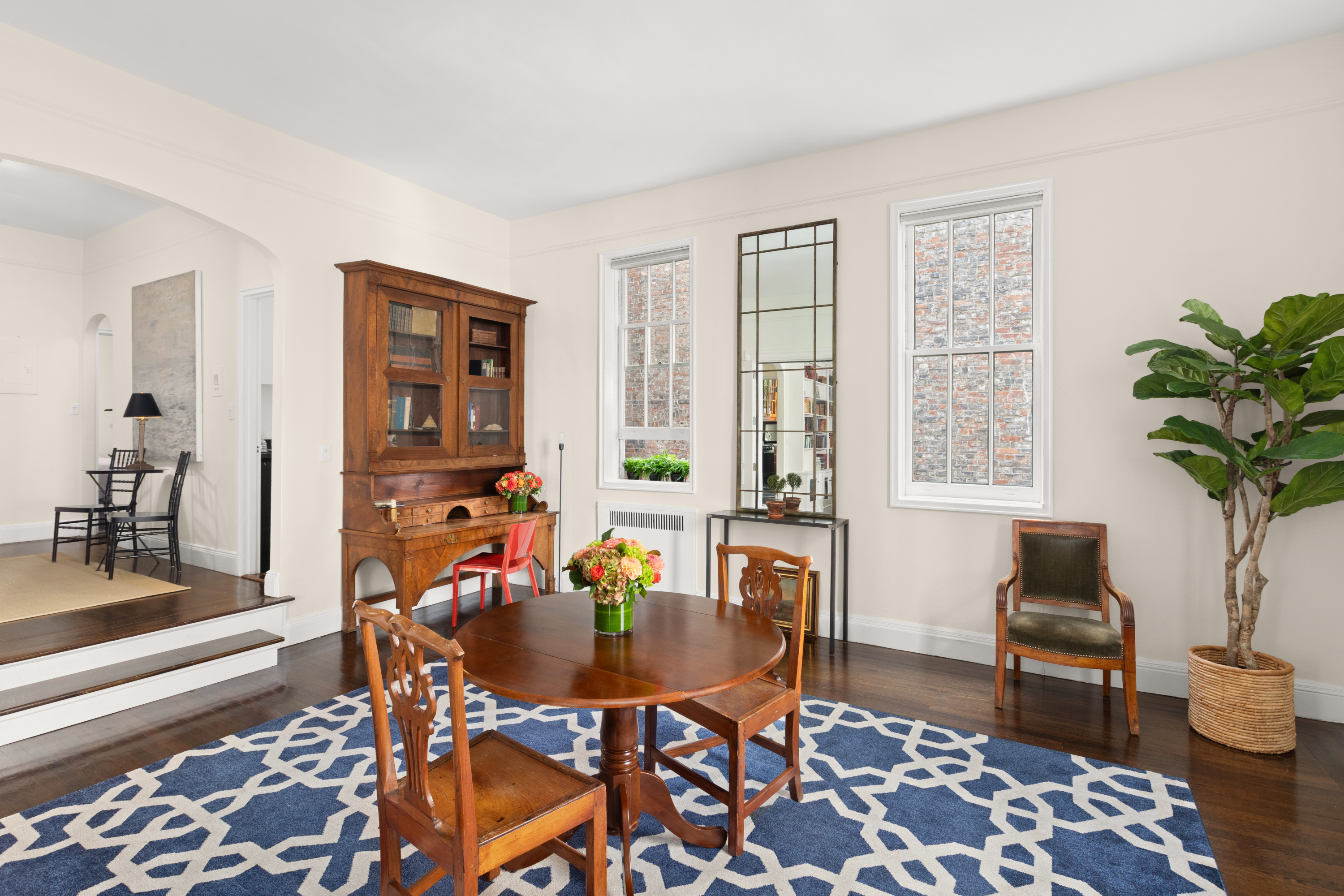 51 East 78th Street, Unit 3BC Manhattan, NY 10075 - Photo 16 of 25 a living room with furniture and a potted plant