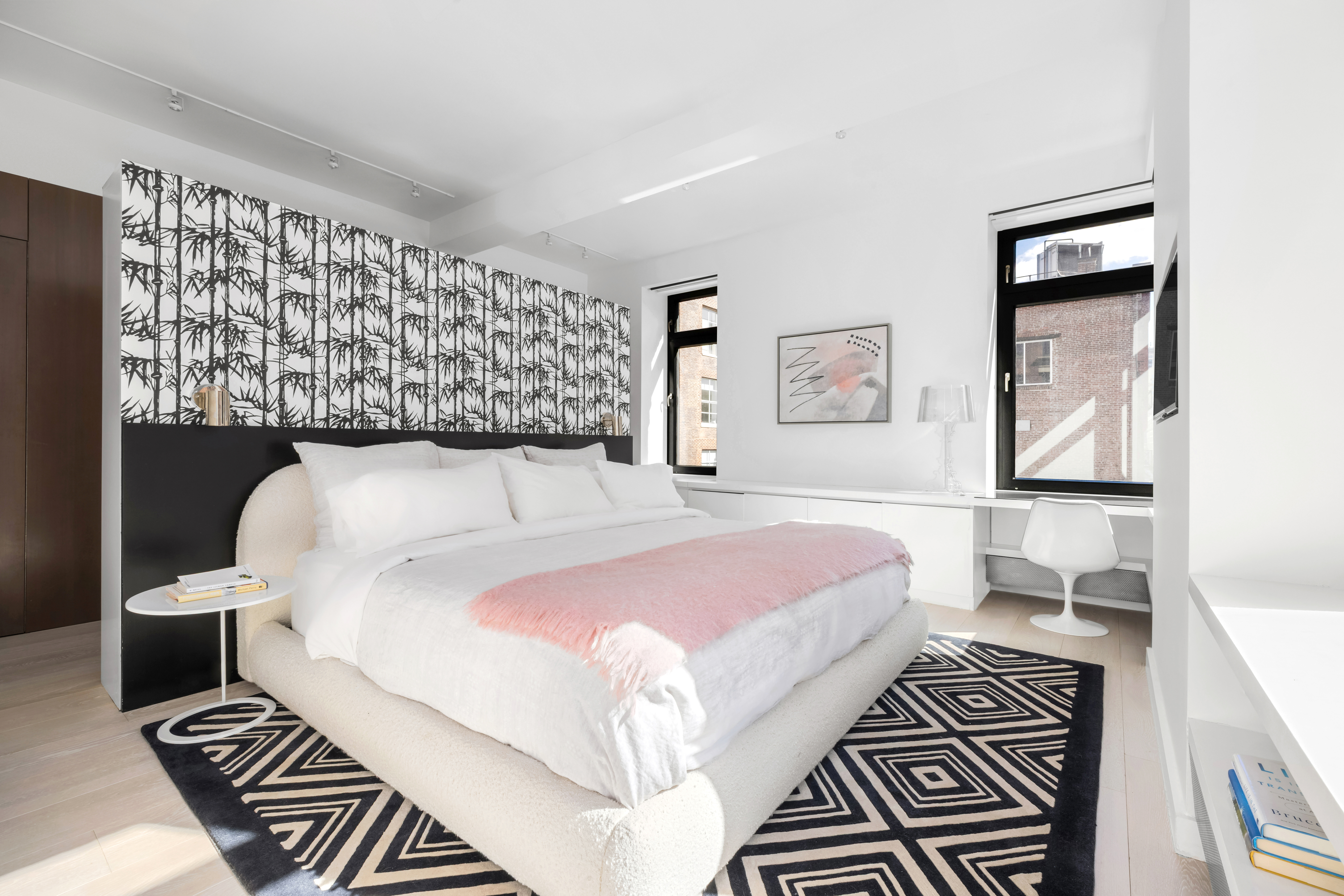 138 Reade Street, Unit 5 Manhattan, NY 10013 - Photo 14 of 23 a bedroom with a bed and a painting on the wall