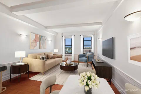 a living room with furniture flat screen tv and window