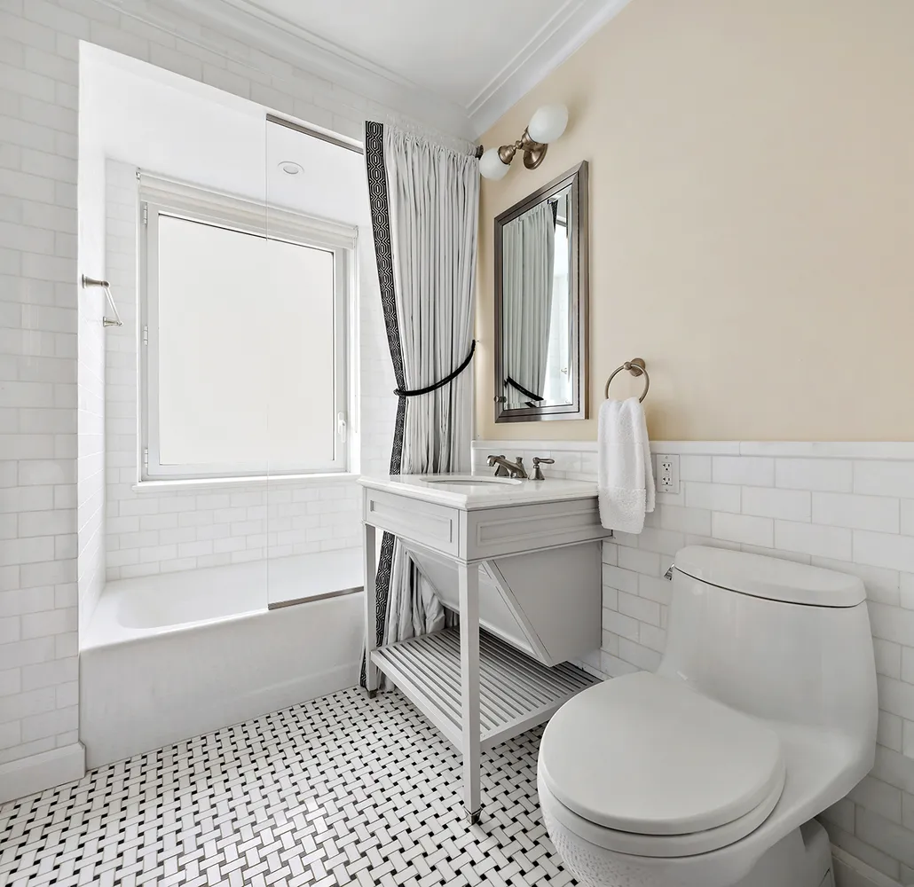 a bathroom with a toilet a sink and a bathtub