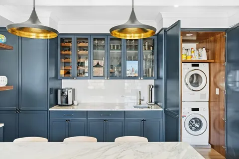 a bathroom with a sink a mirror and shower