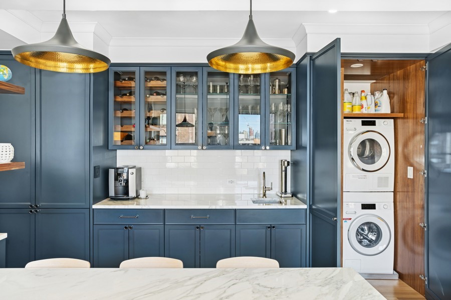 350 East 57th Street, Unit 14B Manhattan, NY 10022 - Photo 8 of 14 a bathroom with a sink a mirror and shower