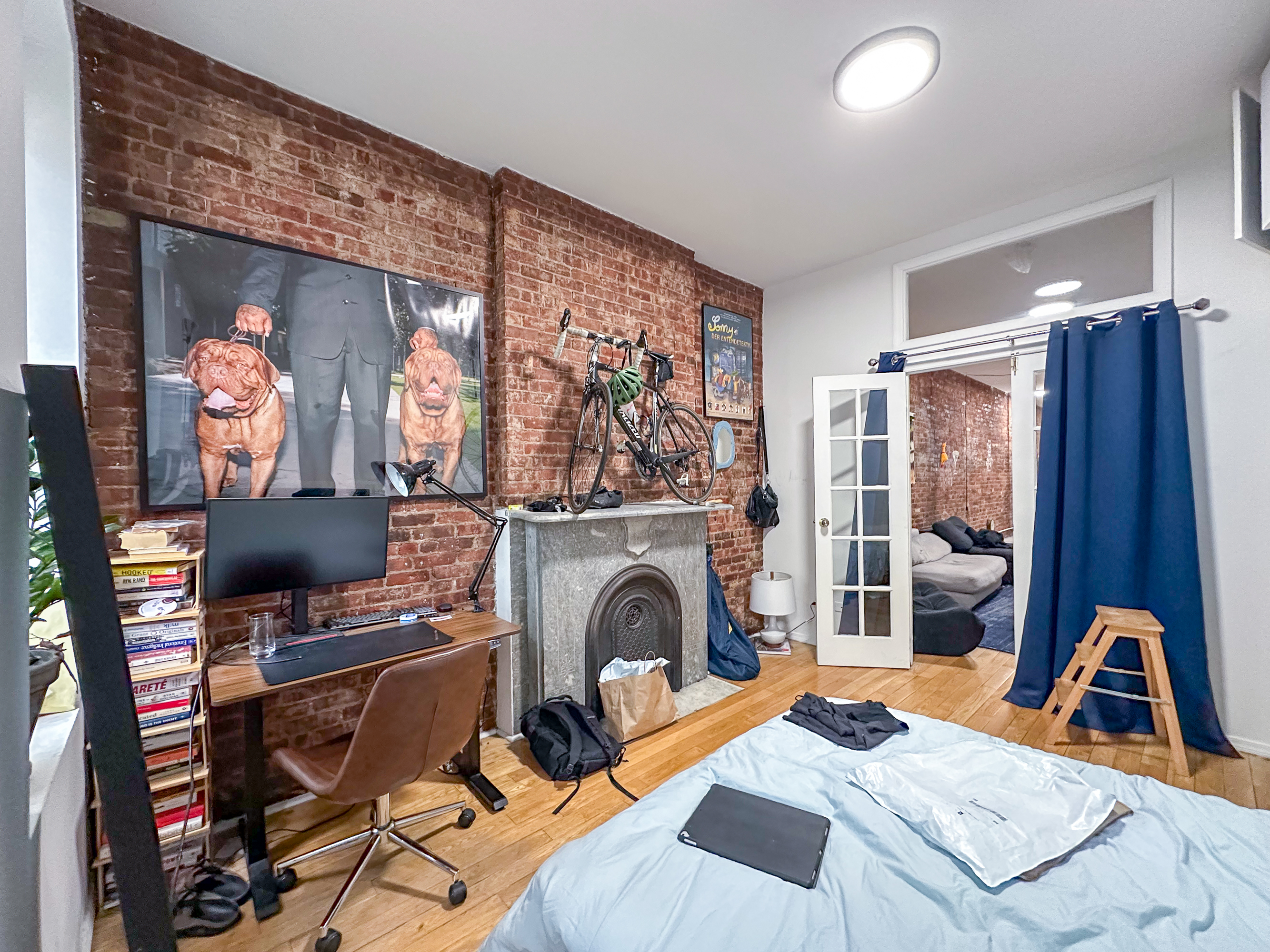 213 East 5th Street, Unit 5 Manhattan, NY 10003 - Photo 4 of 17 a view of a livingroom with furniture and a flat screen tv