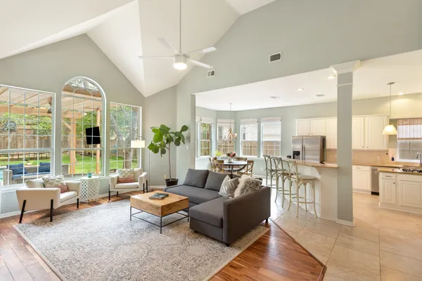 a living room with furniture and a large window