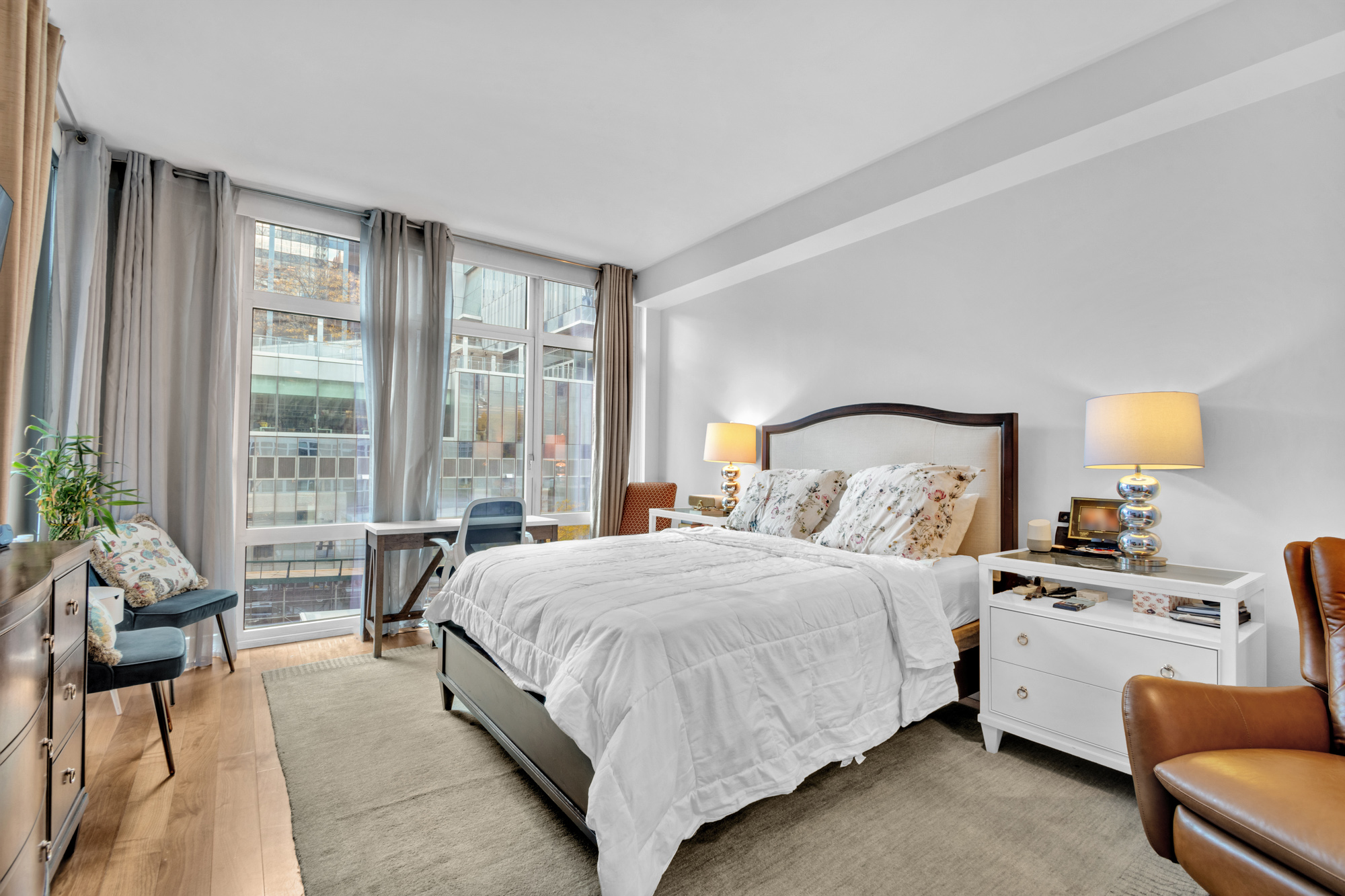 555 West 59th Street, Unit TH3C Manhattan, NY 10019 - Photo 9 of 14 a bedroom with a bed and glass windows