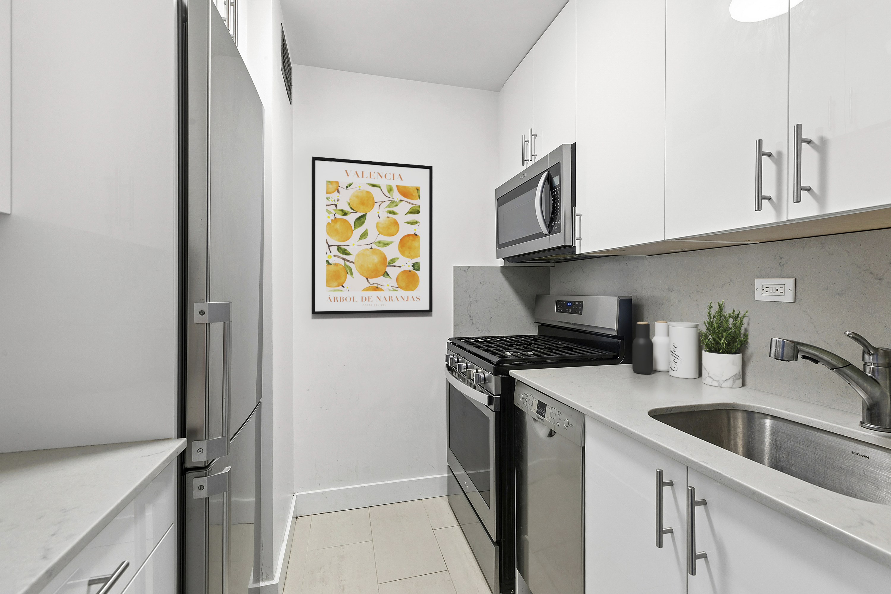 201 East 17th Street, Unit 30F New York, NY 10003 - Photo 3 of 14 a kitchen with stainless steel appliances granite countertop a sink a stove and a refrigerator