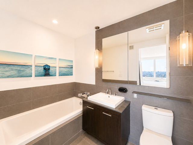 22 North 6th Street, Unit 23K Brooklyn, NY 11249 - Photo 9 of 11 a bathroom with a sink a toilet and a bathtub
