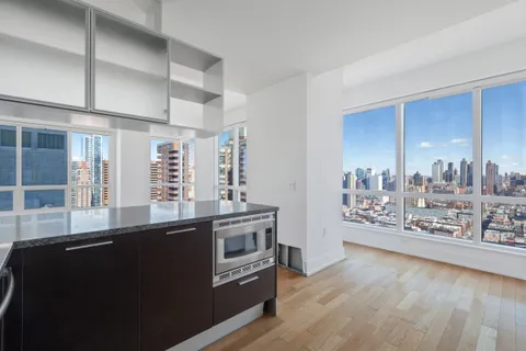 a kitchen with stainless steel appliances a stove and a refrigerator