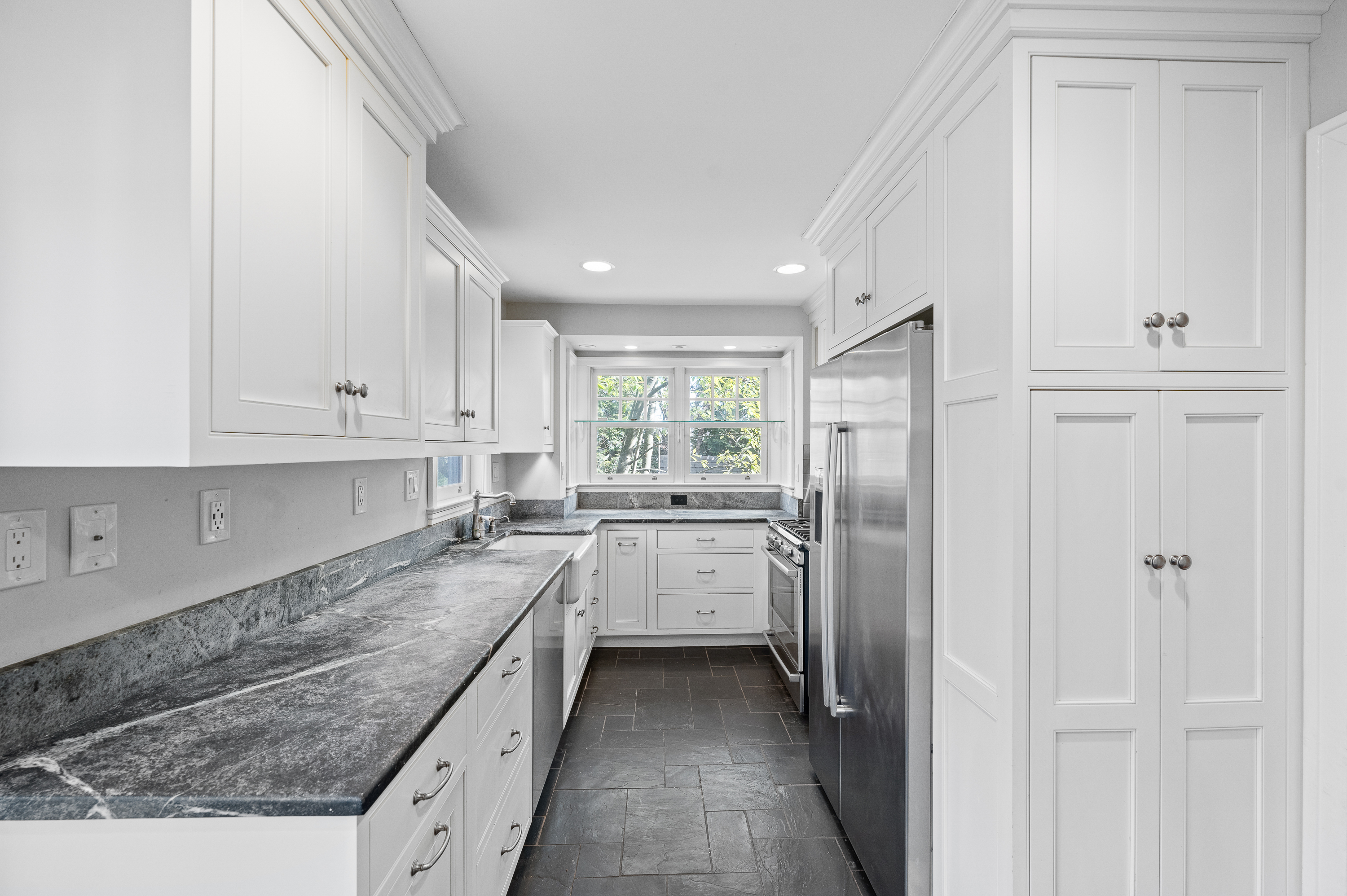201 West Avenue Wayne, PA 19087 - Photo 9 of 26 a kitchen with a sink refrigerator and cabinets