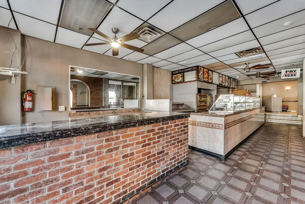 a large white kitchen with a large stove a sink and dishwasher