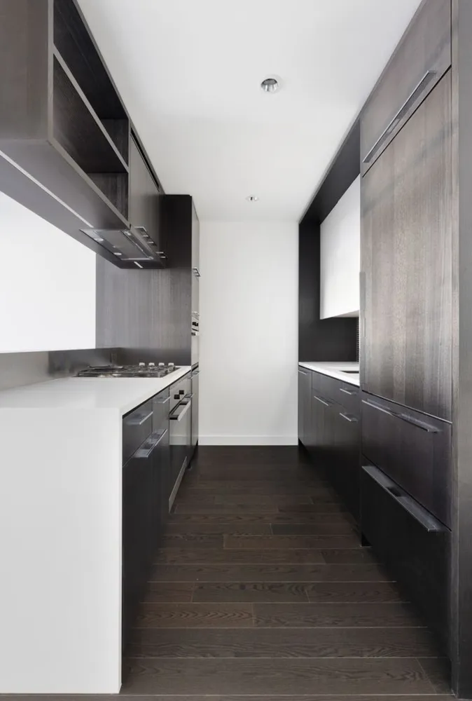 a kitchen with cabinets and stainless steel appliances