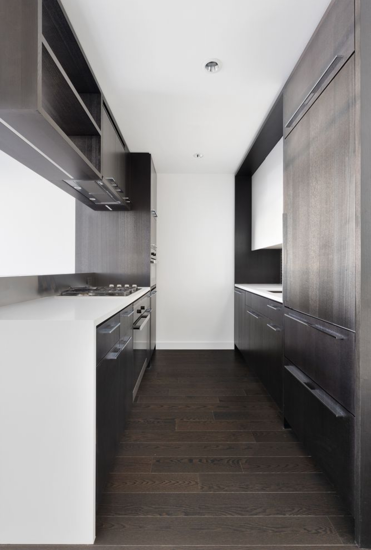 252 South Street, Unit 53B Manhattan, NY 10002 - Photo 5 of 24 a kitchen with cabinets and stainless steel appliances