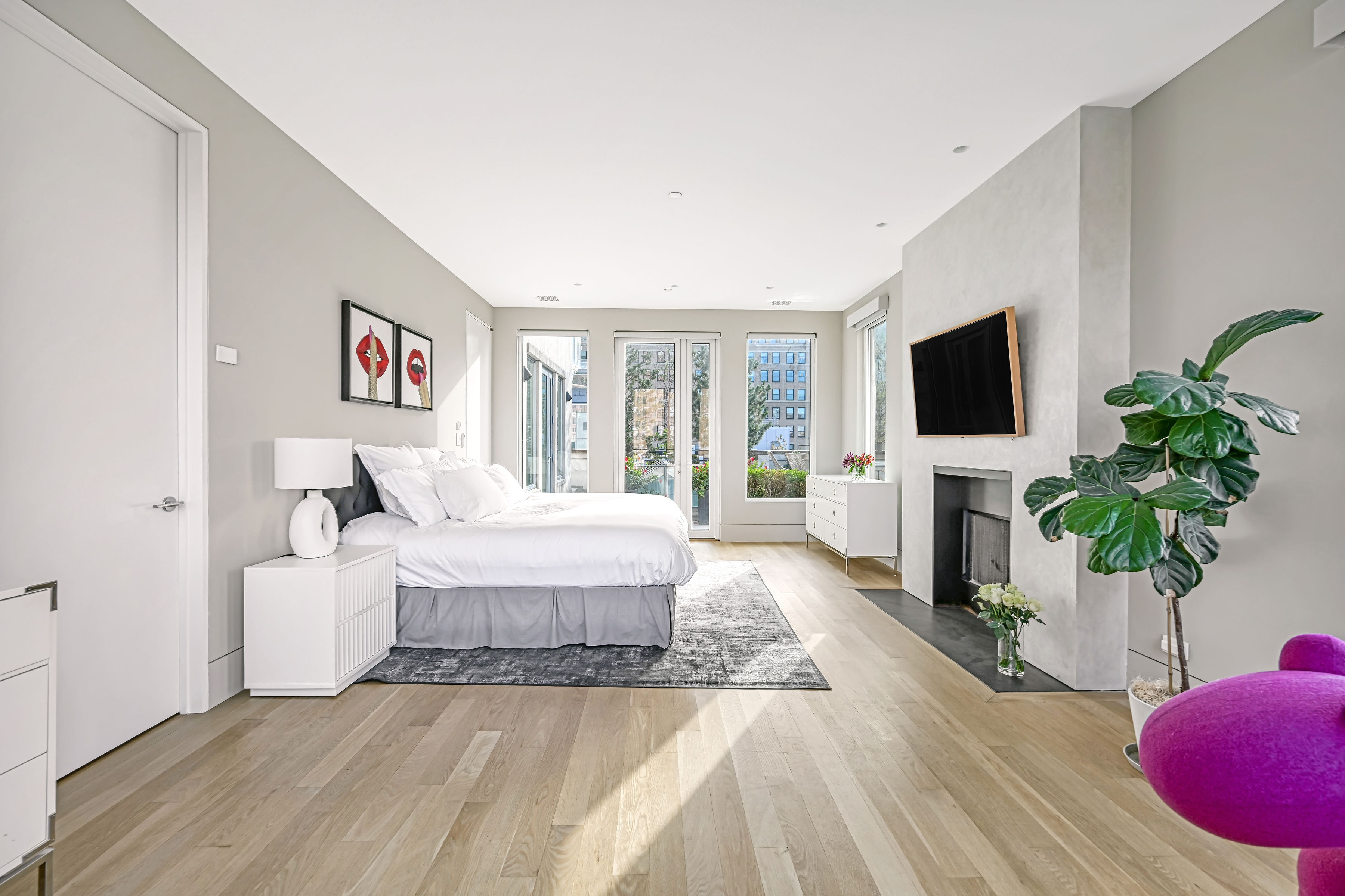 53 Leonard Street, Unit PH Manhattan, NY 10013 - Photo 17 of 24 a spacious bedroom with a bed and a flat screen tv