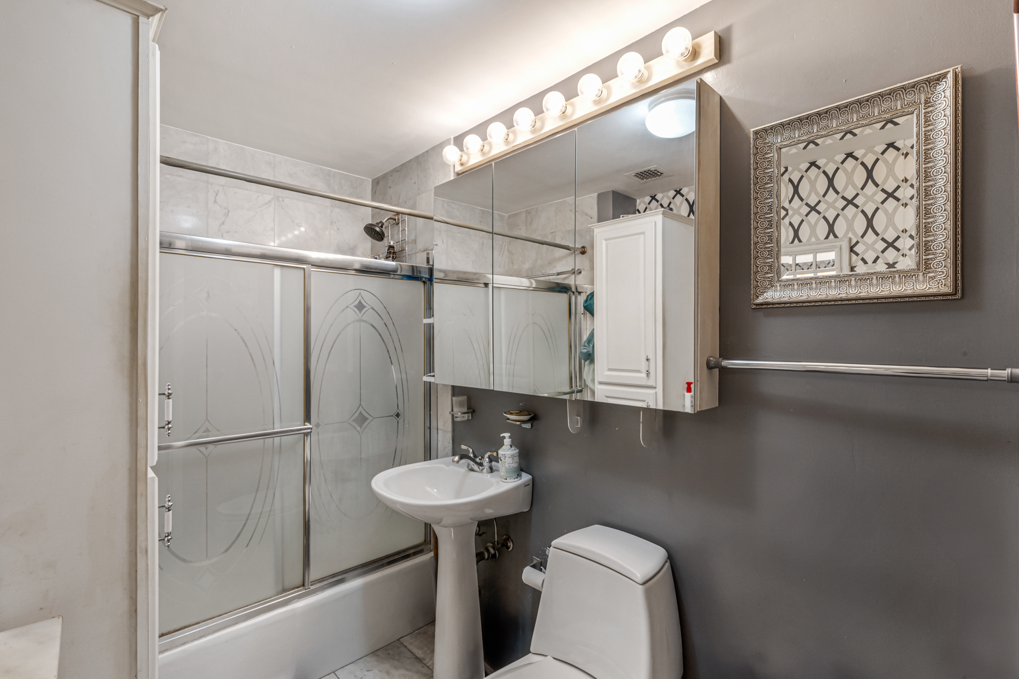 270 5th Street, Unit 4C Brooklyn, NY 11215 - Photo 8 of 11 a bathroom with a sink toilet and shower