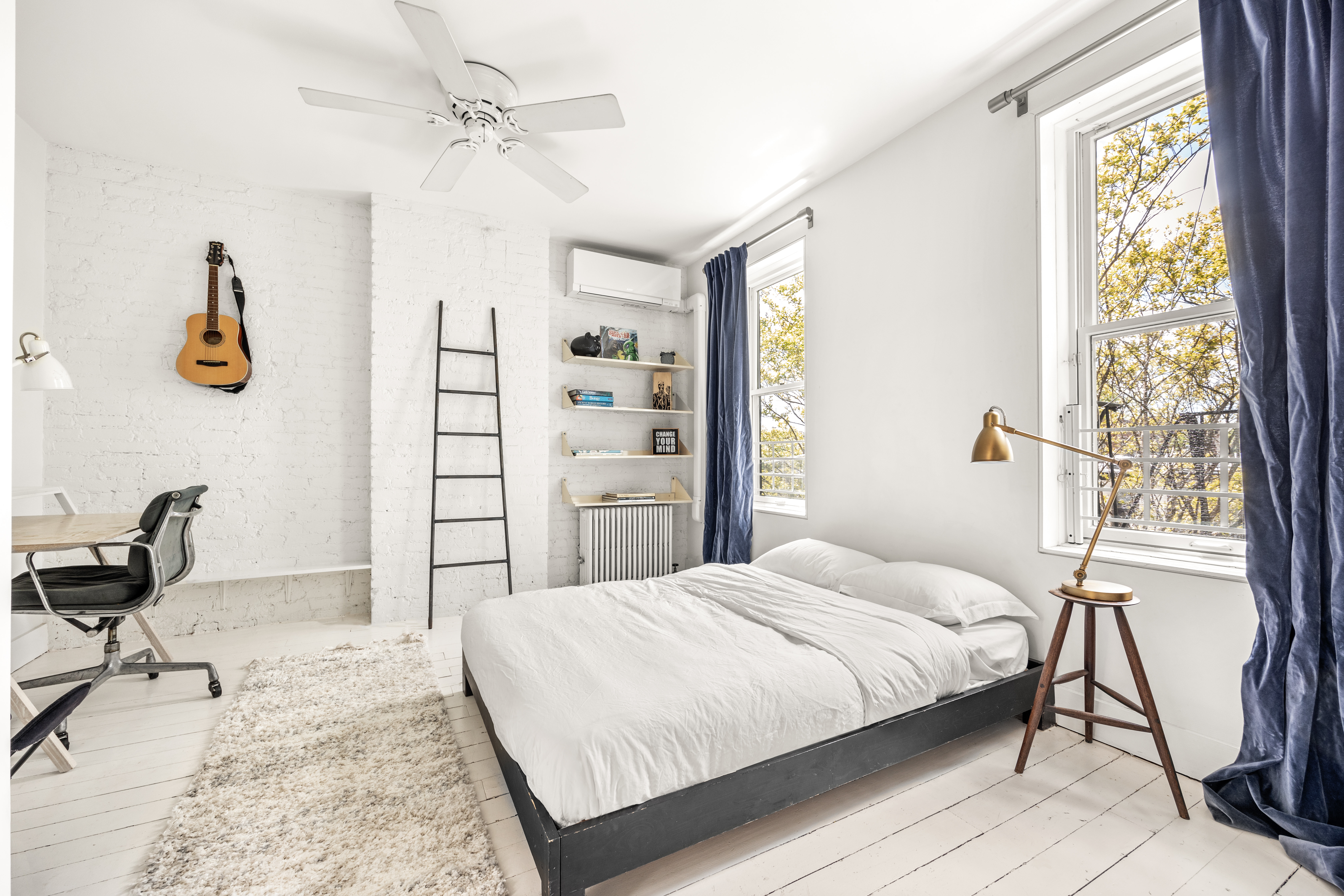 26 A 1st Street Brooklyn, NY 11231 - Photo 12 of 20 a bedroom with a bed a chair and a chandelier