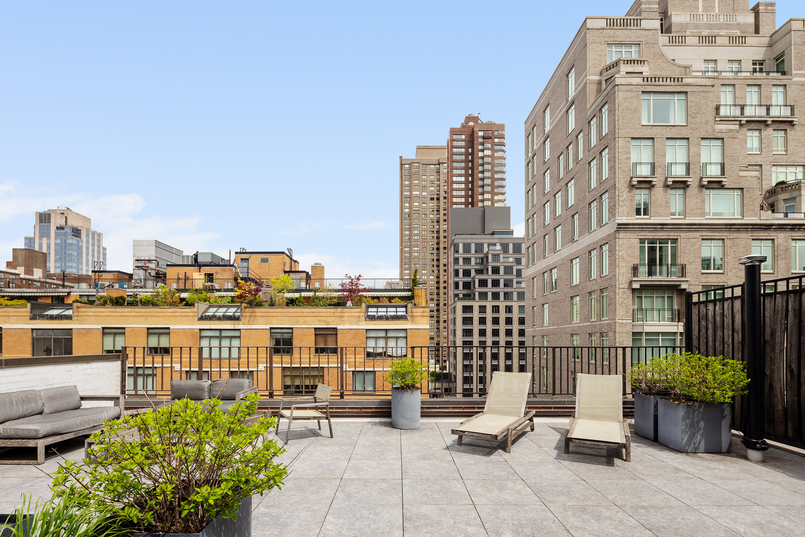 10 East End Avenue, Unit 18D Manhattan, NY 10075 - Photo 17 of 21 a view of a building with many windows