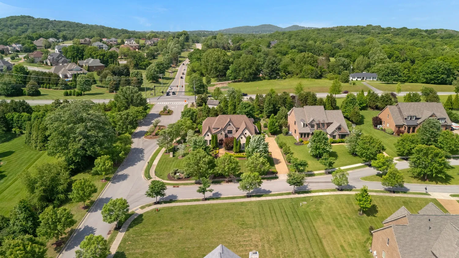 an aerial view of residential house with outdoor space and river view