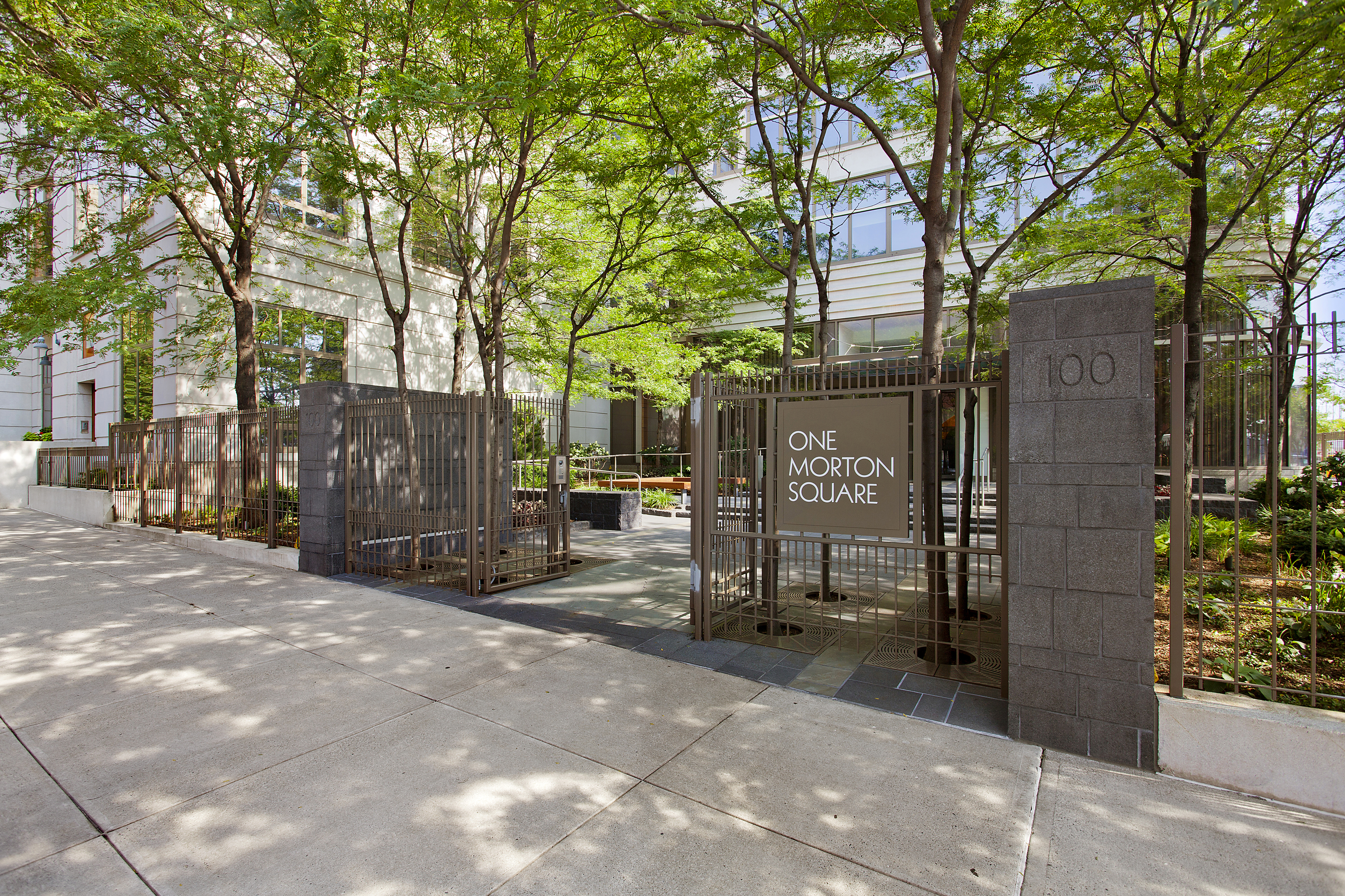 100 Morton Street, Unit 14CW Manhattan, NY 10014 - Photo 7 of 8 a view of a building with a bench in front of building