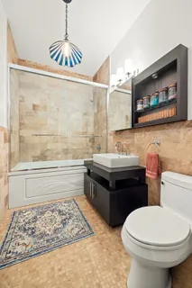 a bathroom with a sink a toilet and a bathtub