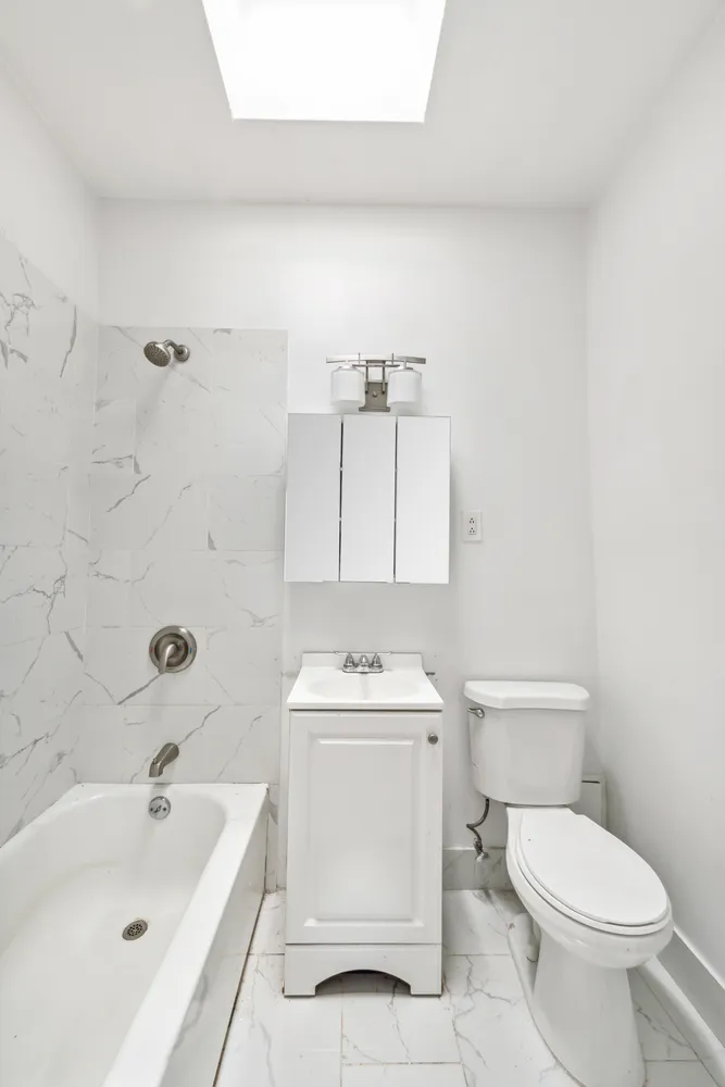 a bathroom with a sink toilet and bathtub