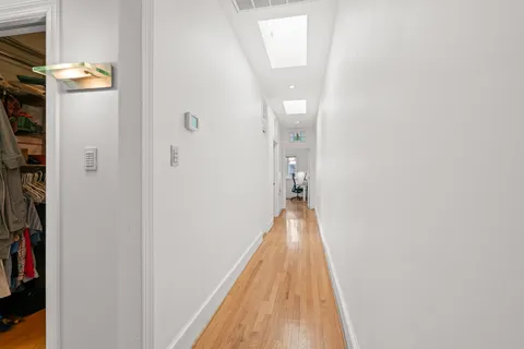 a view of a bathroom from the hallway