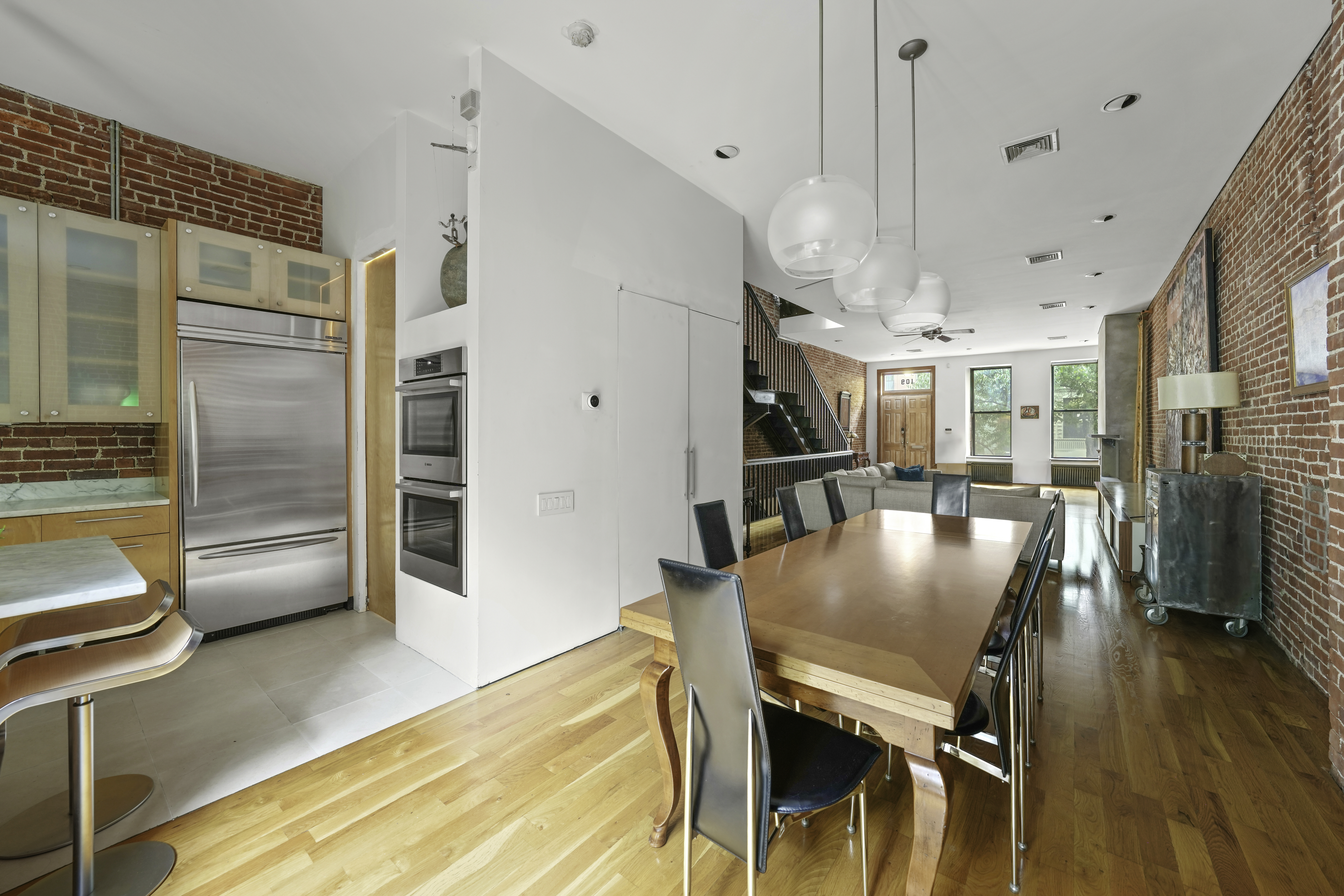 109 West 118th Street Manhattan, NY 10026 - Photo 6 of 31 a view of a dining room with furniture and wooden floor