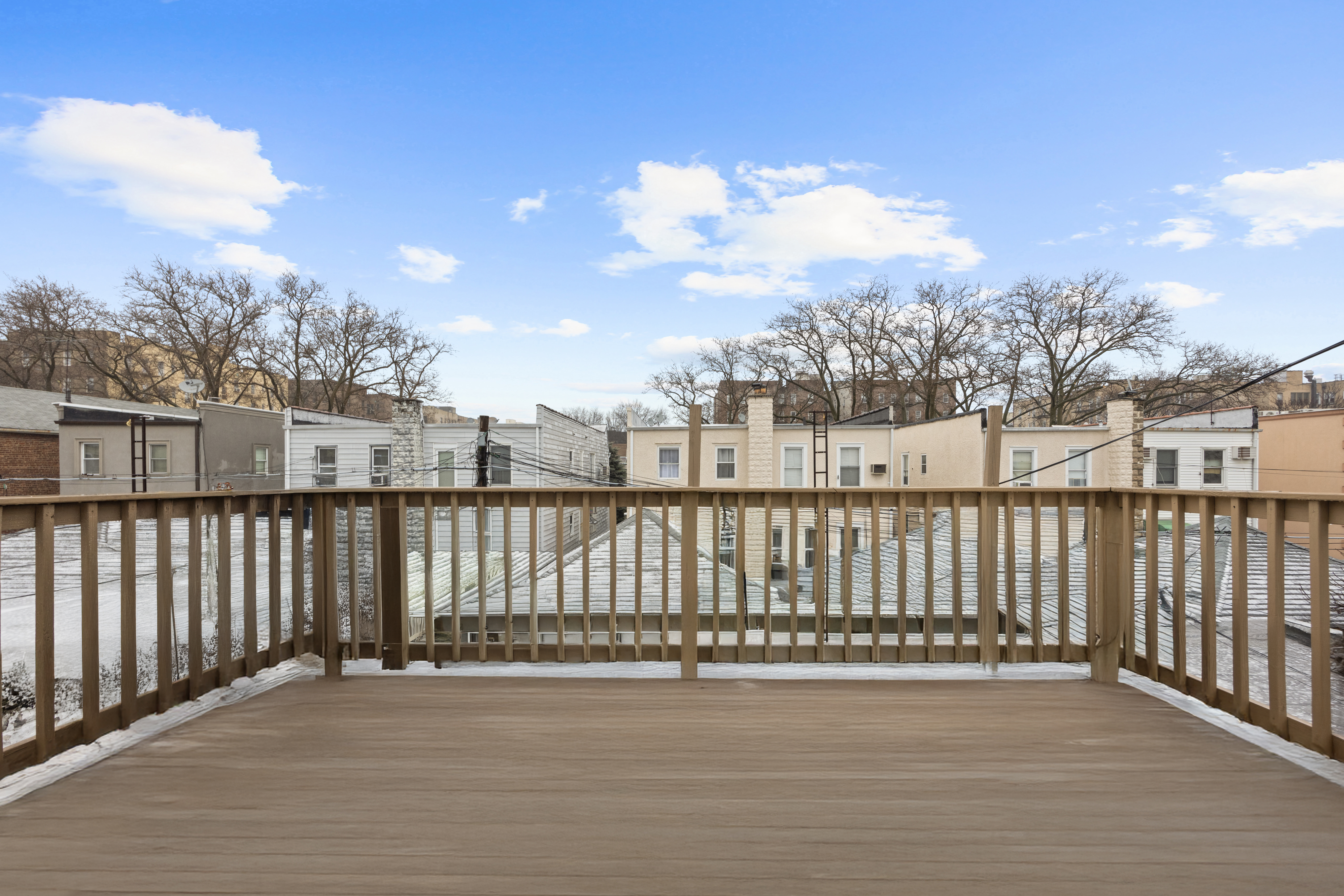 1635 West 12th Street Brooklyn, NY 11223 - Photo 8 of 21 a view of a balcony with wooden fence