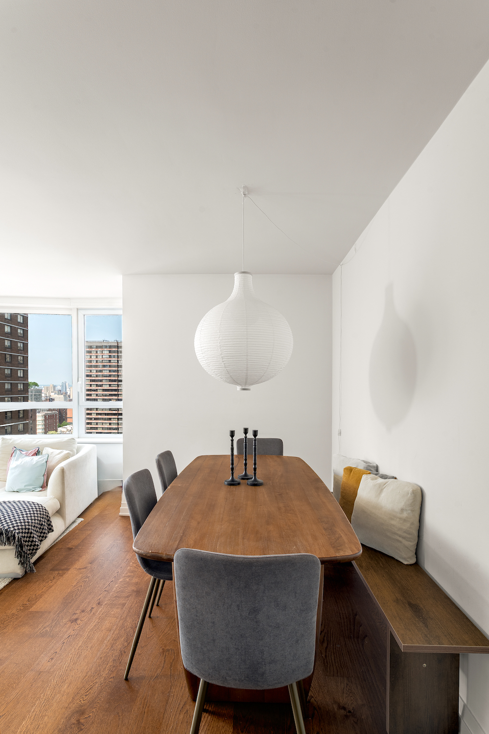 200 East 94th Street, Unit 2015 Manhattan, NY 10128 - Photo 4 of 16 a dining room with furniture and wooden floor