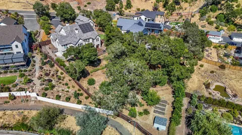 an aerial view of house with yard